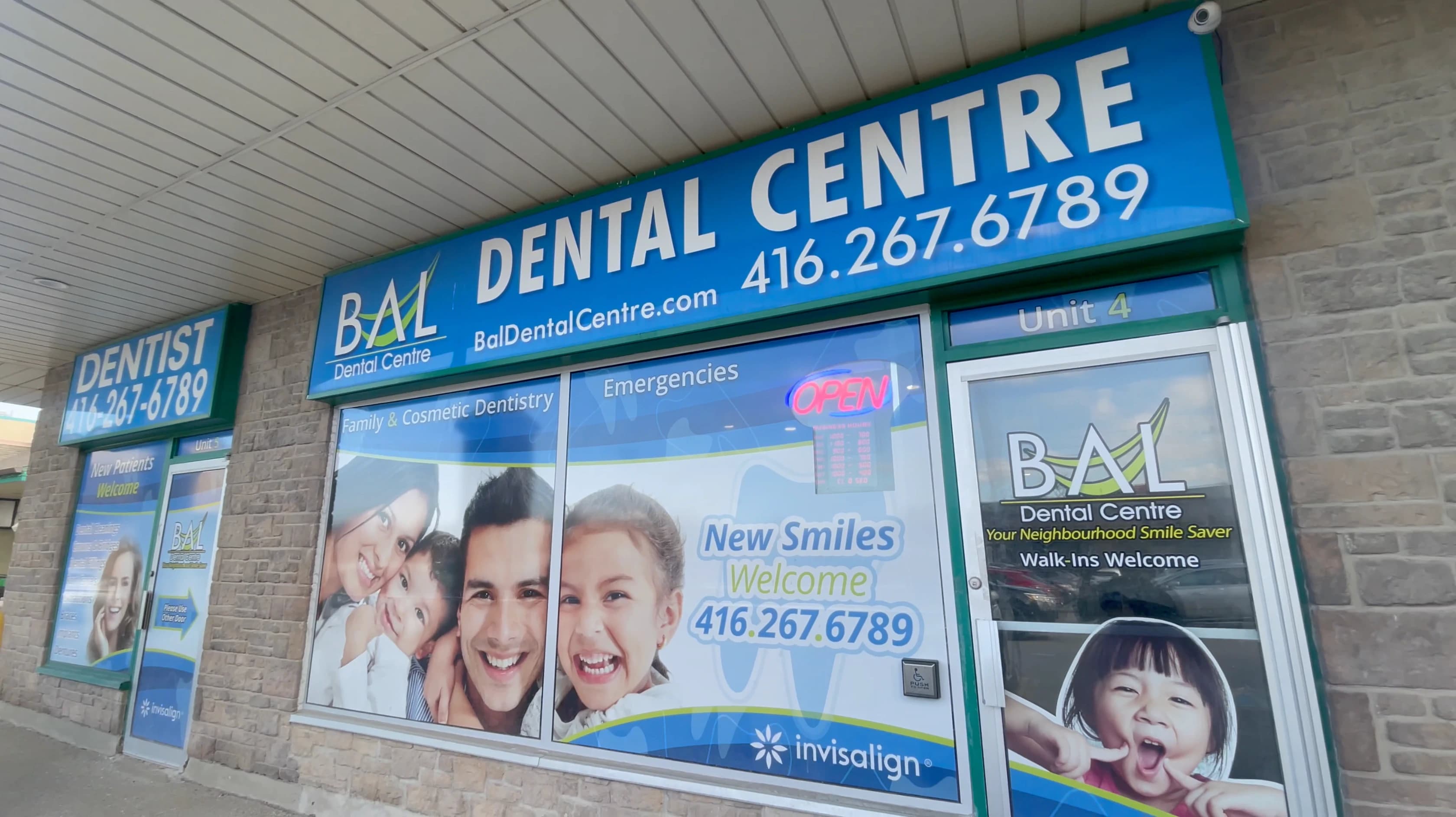 Dentist with smiling patient at Bal Dental Centre